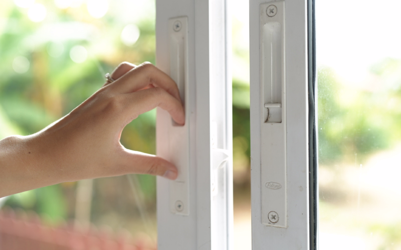 Technician servicing a window locking system